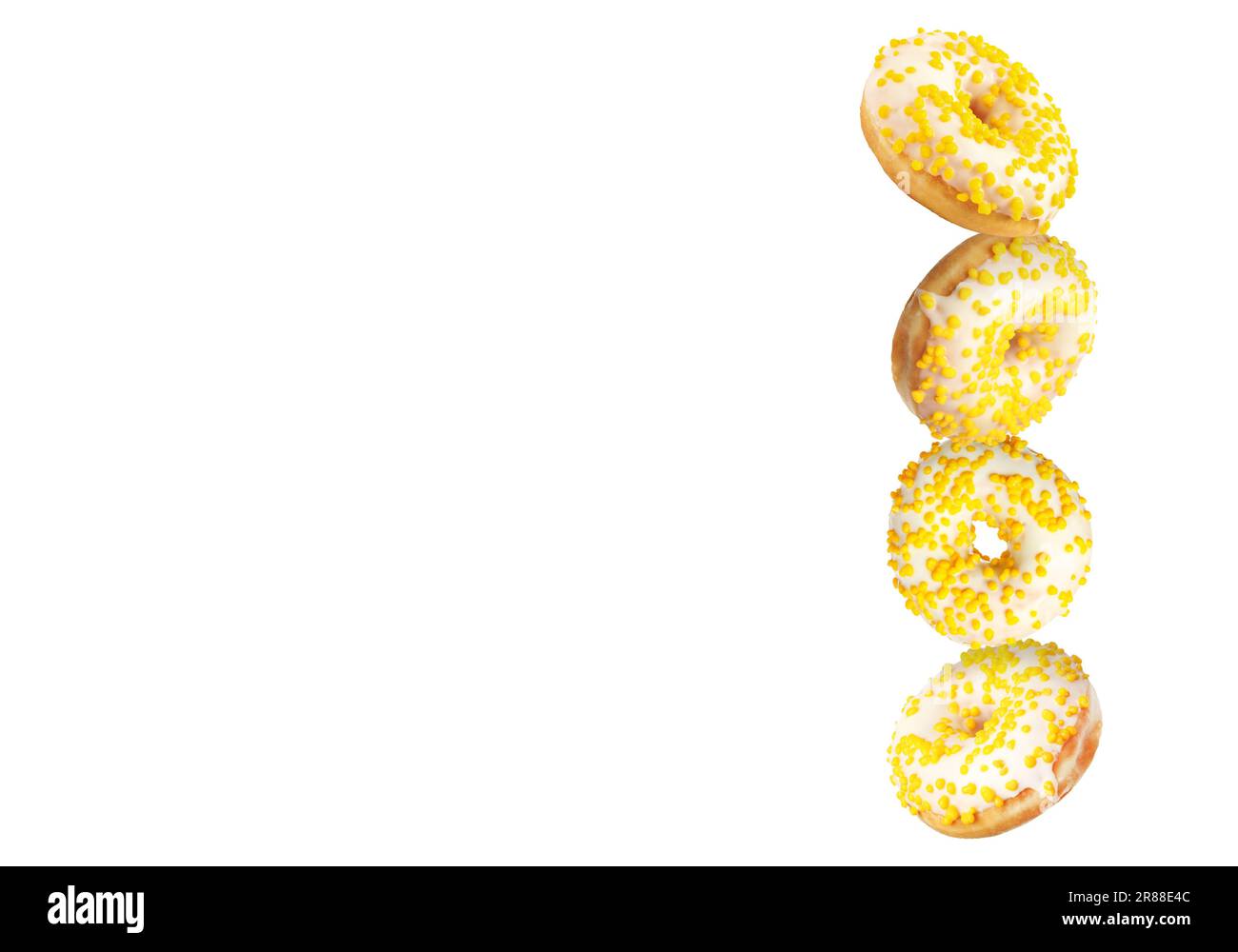 Tasty donuts with sprinkles falling on white background Stock Photo - Alamy