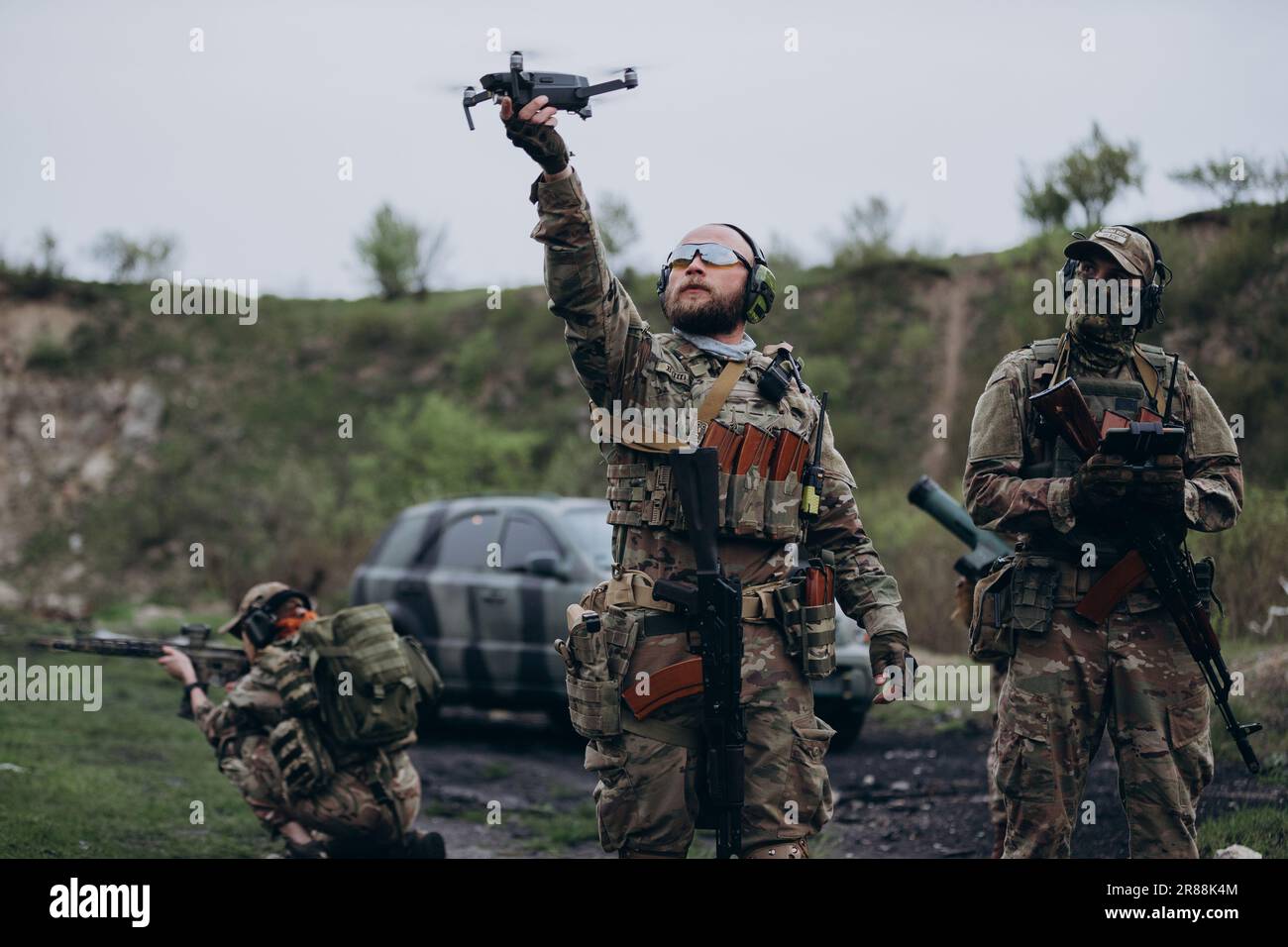 Group of Ukrainian soldiers using a drone at the range Stock Photo - Alamy