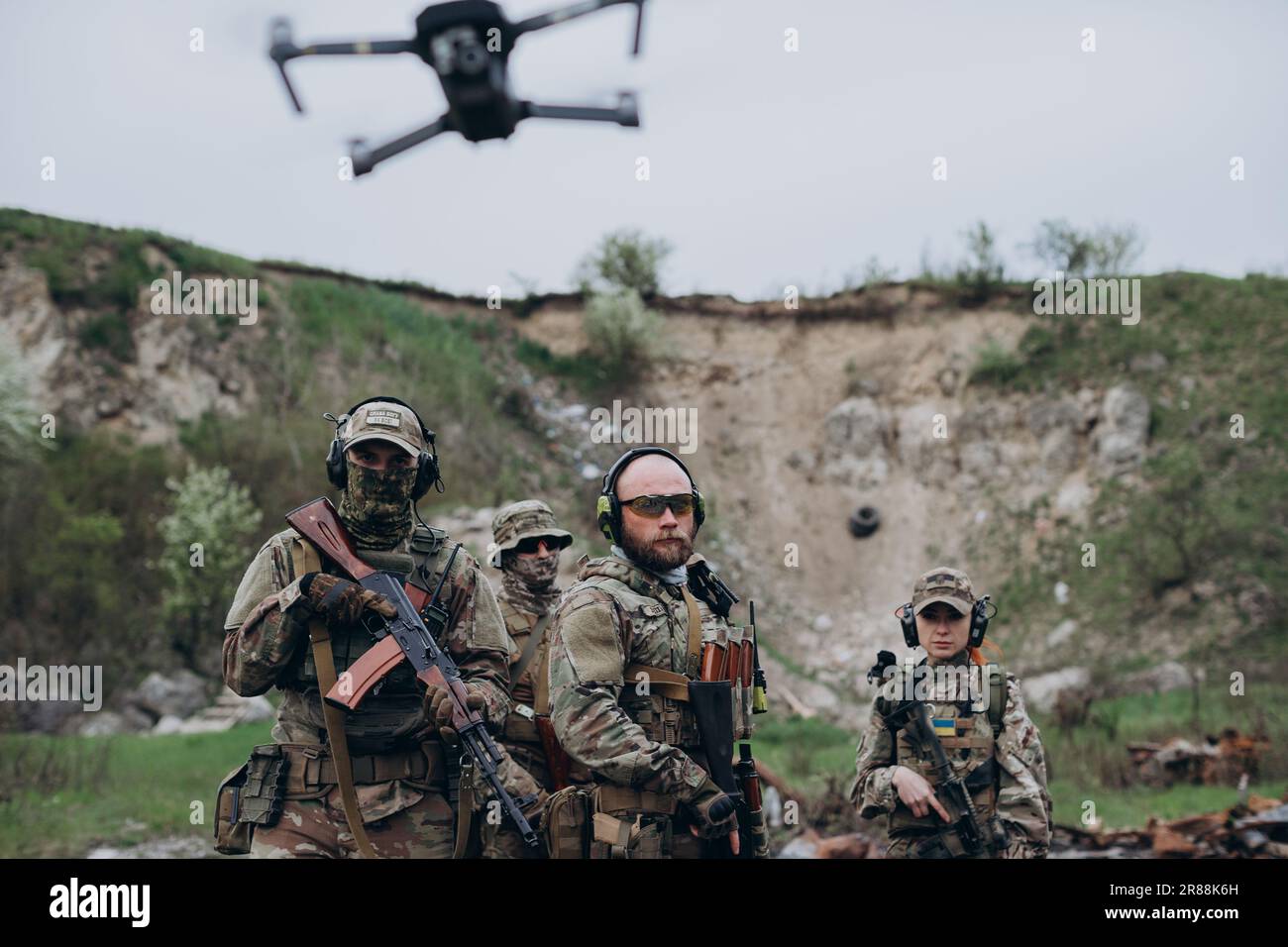 A group of Ukrainian soldiers using a drone and posing for camera Stock ...