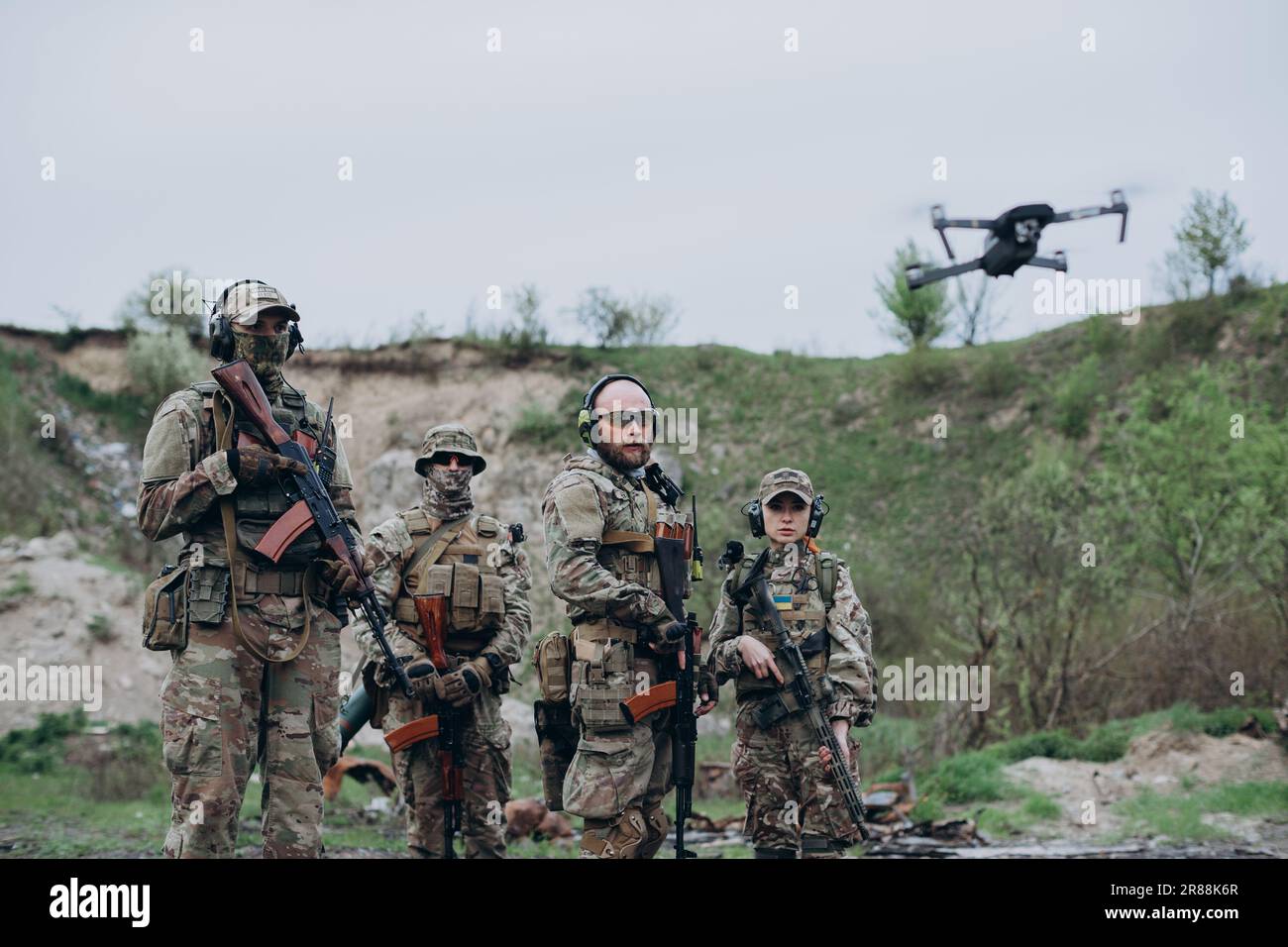 Four armed Ukrainian soldiers looking in the camera with a drone Stock ...