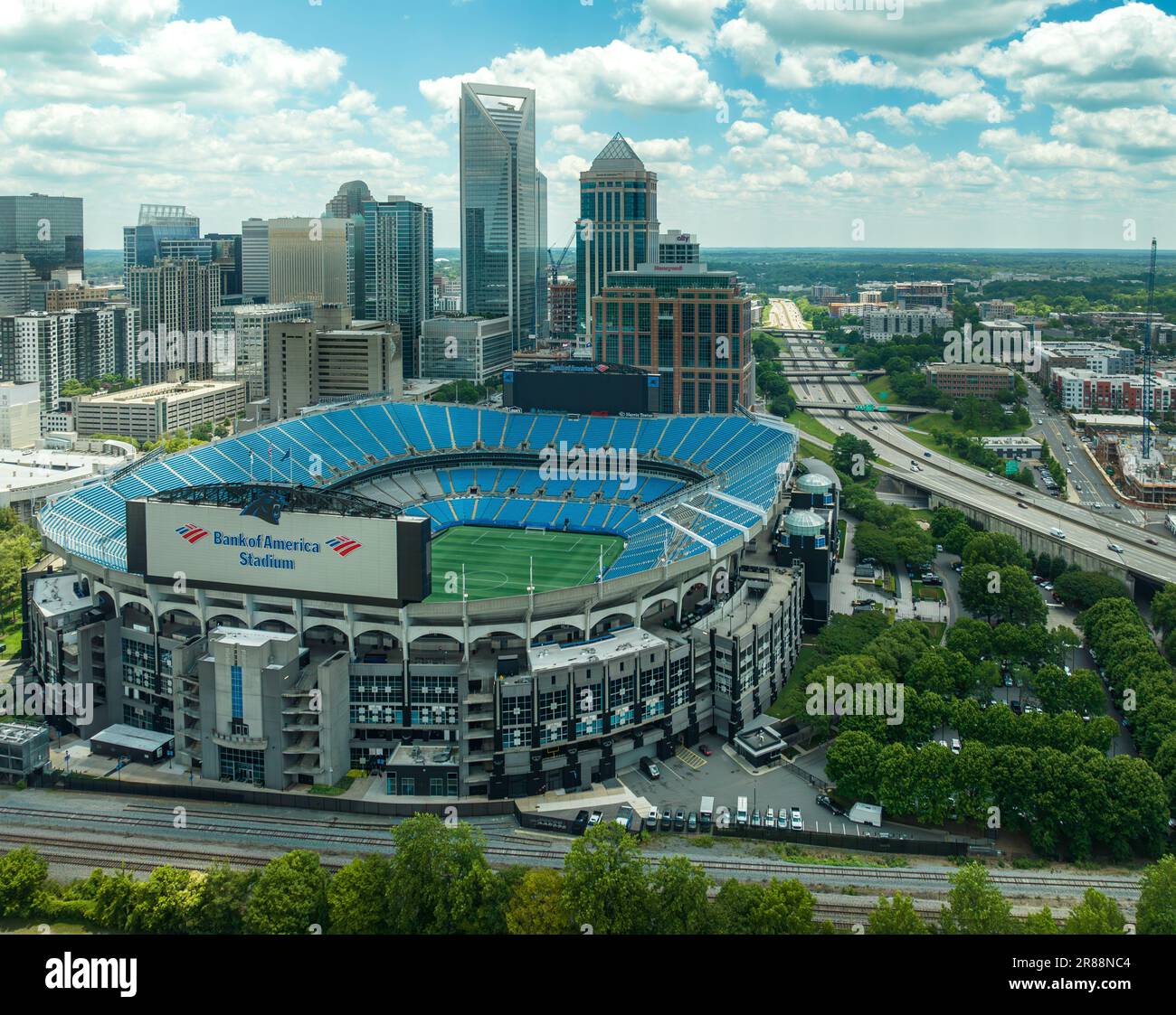 An aerial view of a baseball stadium in the cityscape of Charlotte
