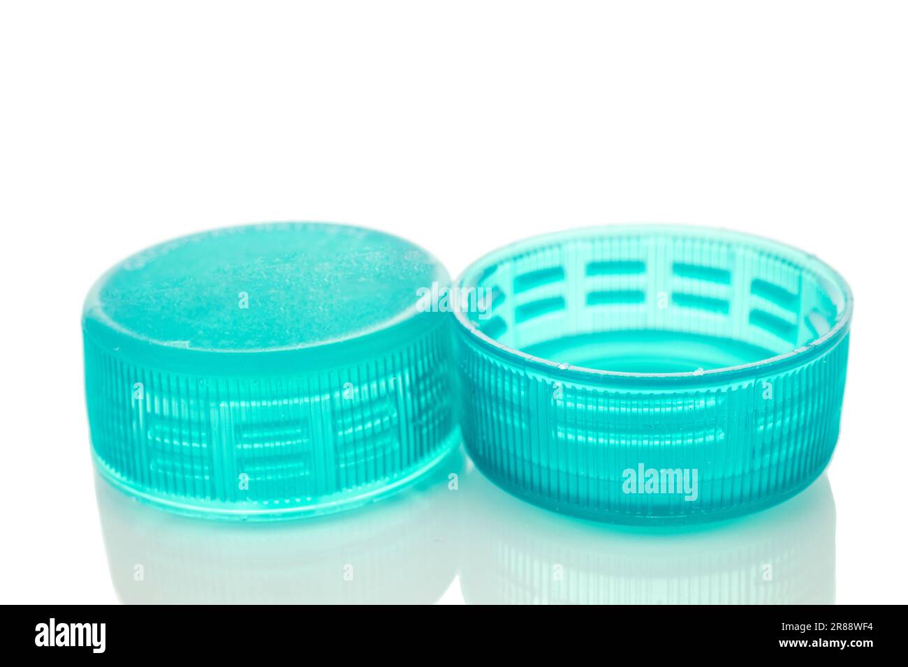 Two plastic bottle caps, macro, isolated on white background Stock ...