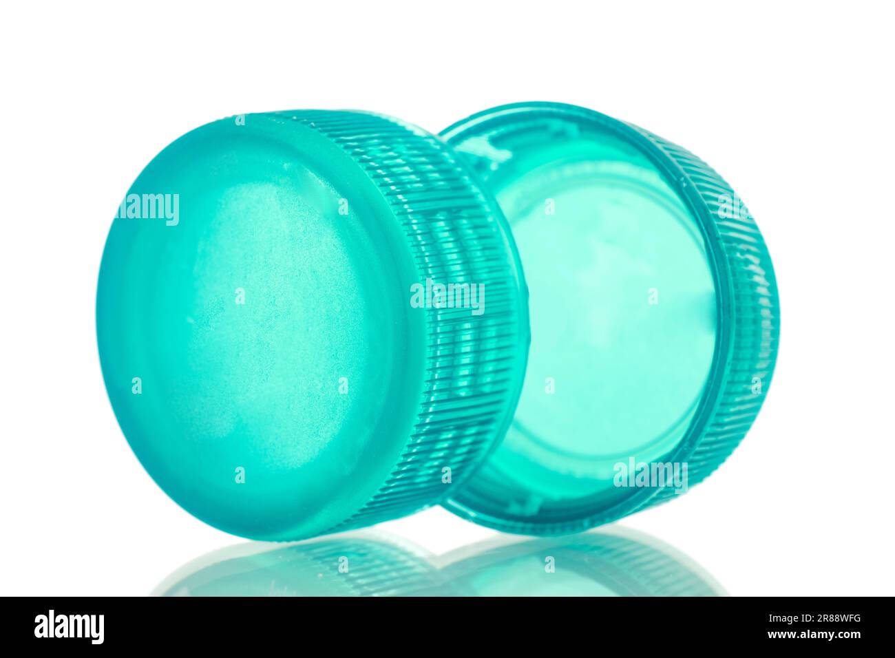 Two plastic bottle caps, macro, isolated on white background Stock ...