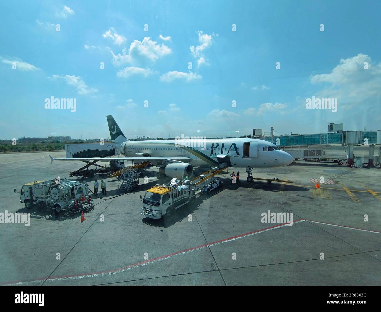 Pakistan International Airline at Karachi International Airport terminal gate ready for takeoff Stock Photo