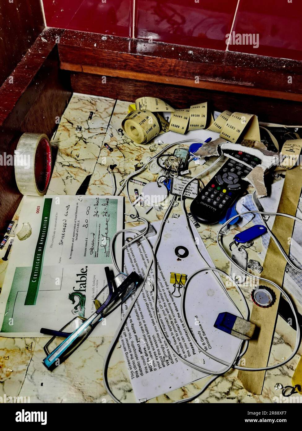 A junk drawer shows miscellaneous items left behind SHEFFIELD, ENGLAND