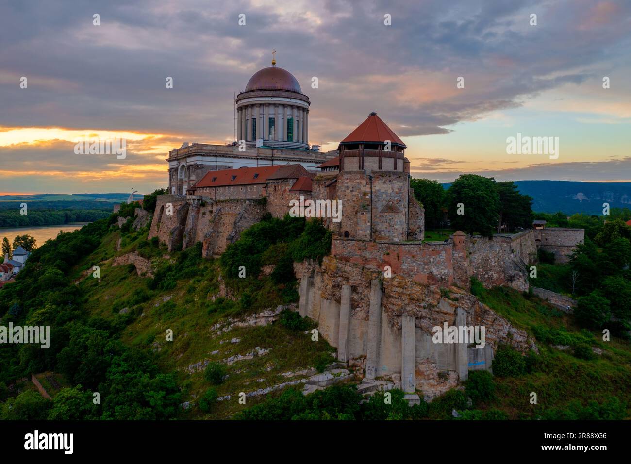 Aerial view about the Castle of Esztergom with the famous Basilica and cloudy sunset at the background Stock Photo
