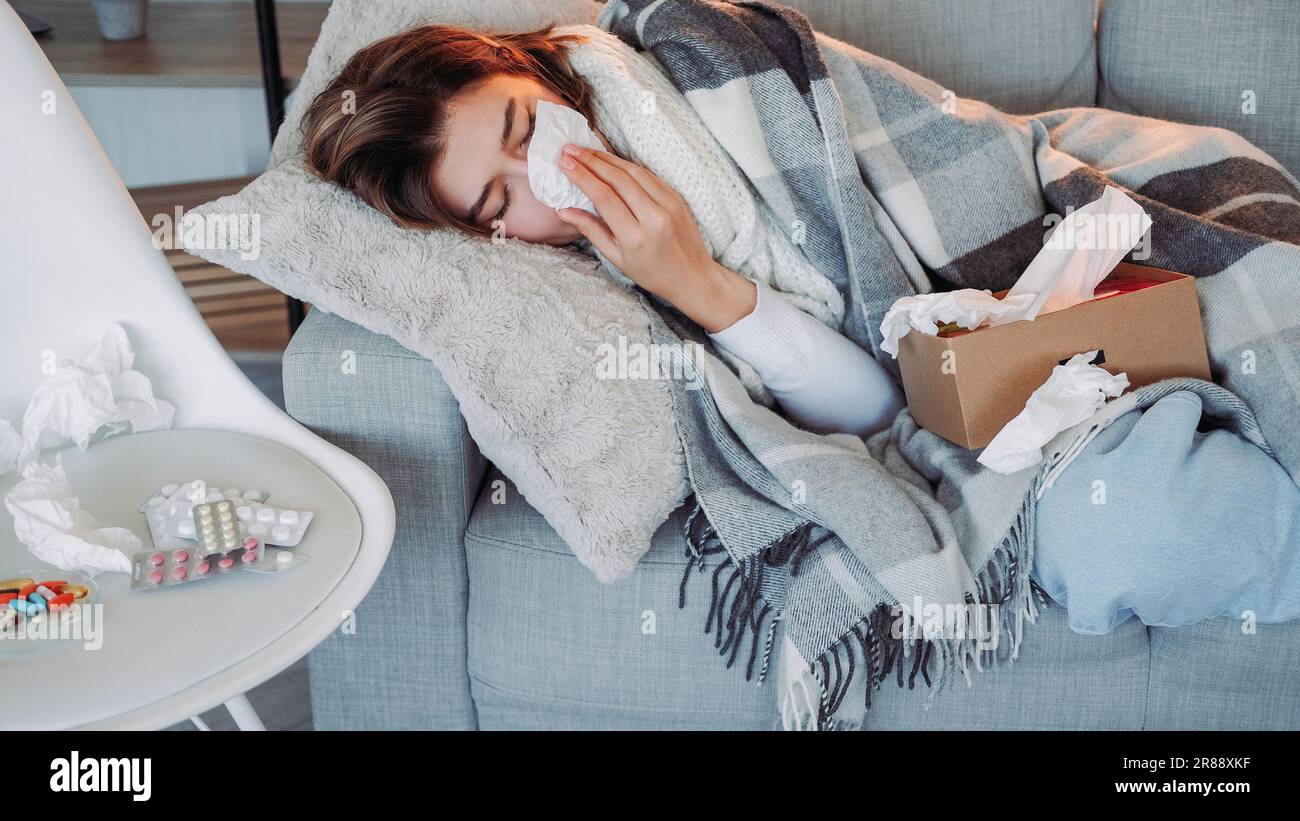 Home flu runny nose symptom suffering woman laying Stock Photo Alamy