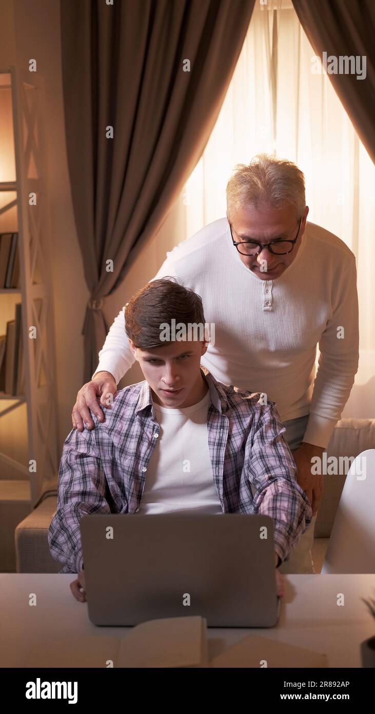 Family technology elderly computer son father Stock Photo - Alamy