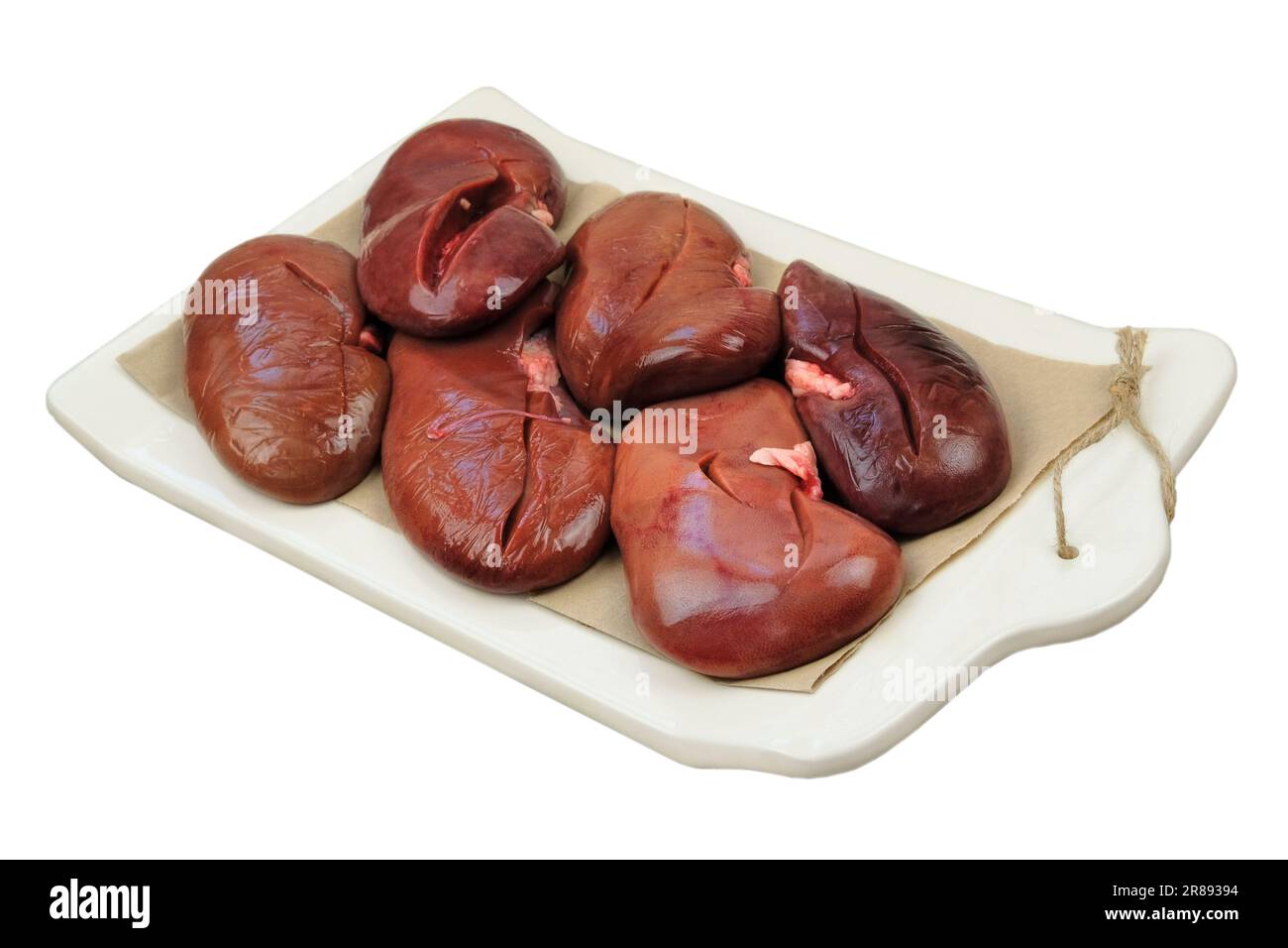 Pork kidneys in board isolated on white background. Raw meat. Stock Photo
