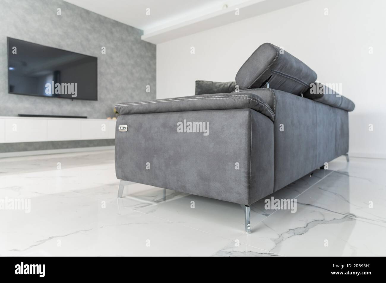 Elegant gray sofa in modern and expensive house Stock Photo Alamy
