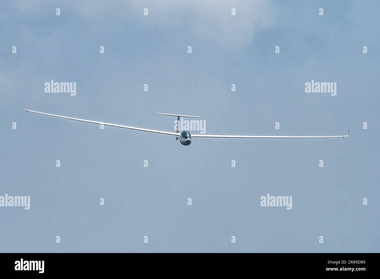 Glider plane flying in the clouds Stock Photo Alamy