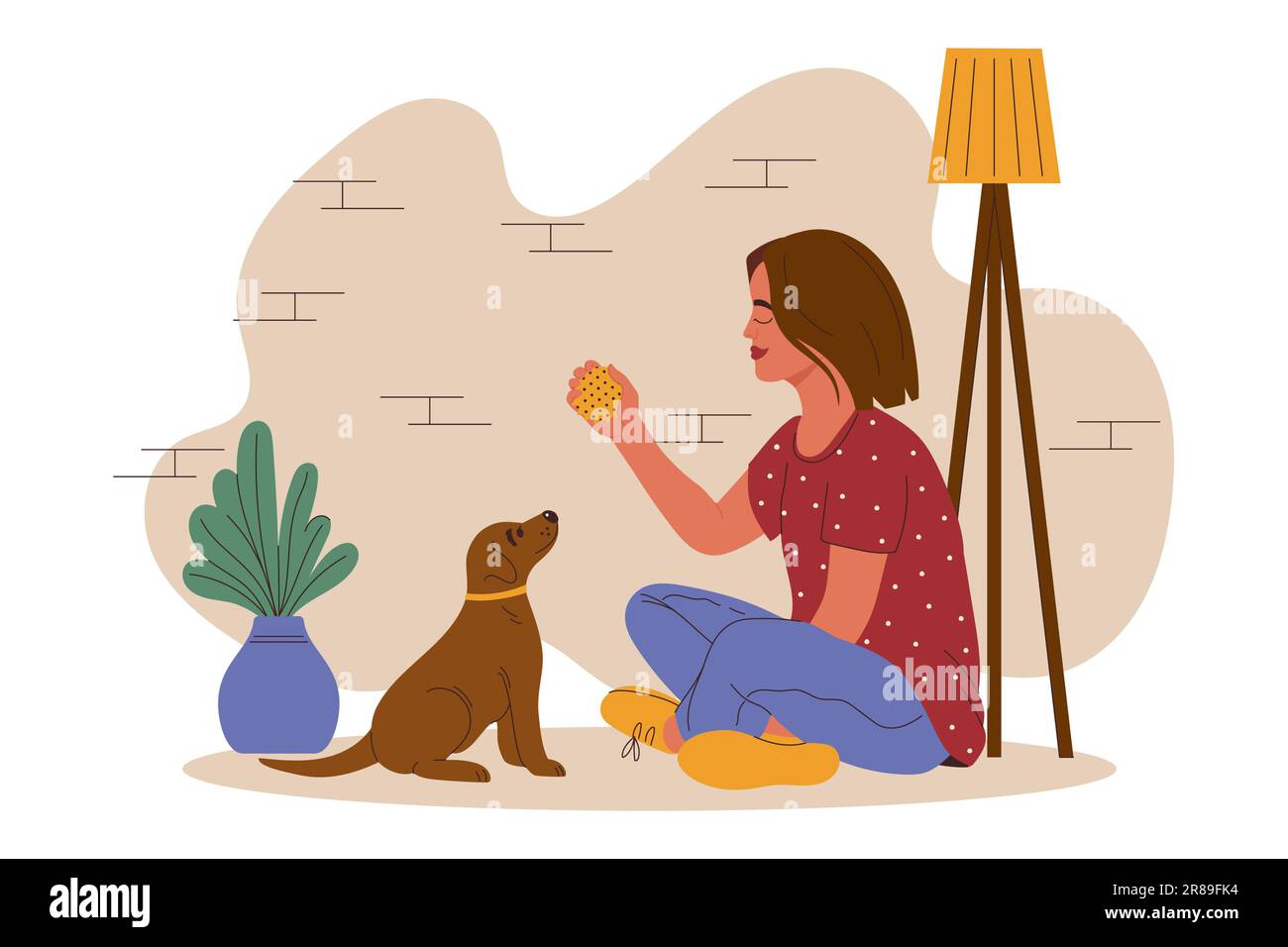 Girl plays with her dog with a brushing toy. Dog dental care concept