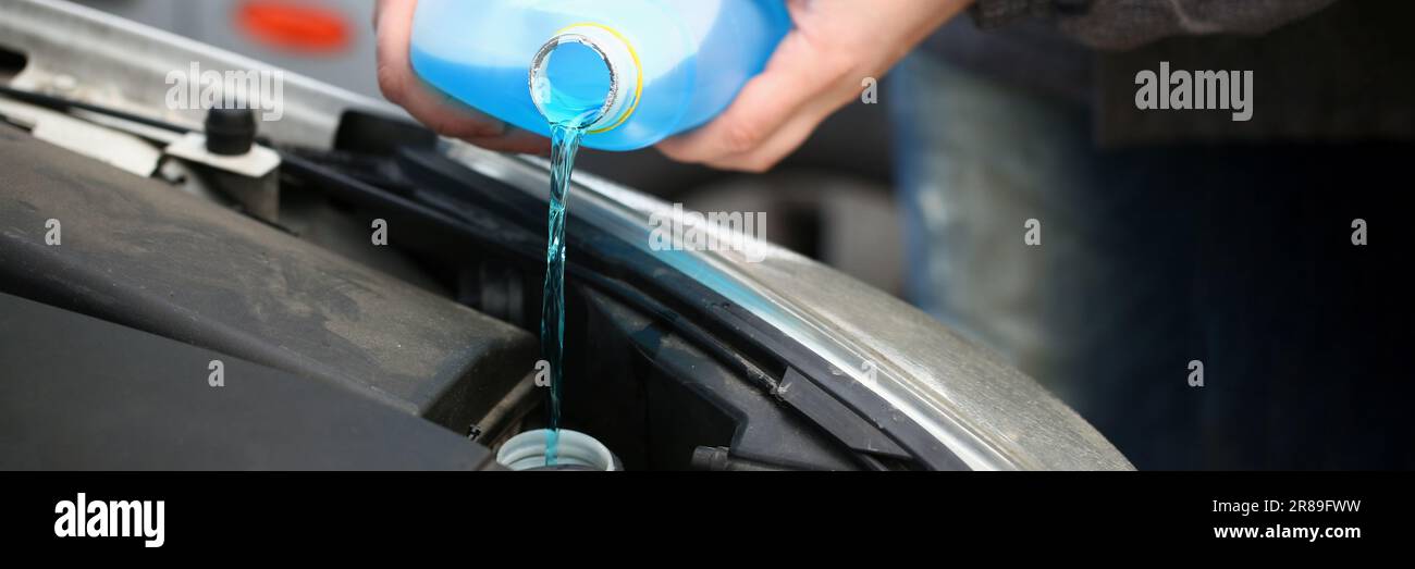 Refueling windshield washer reservoir with antifreeze in winter frosts