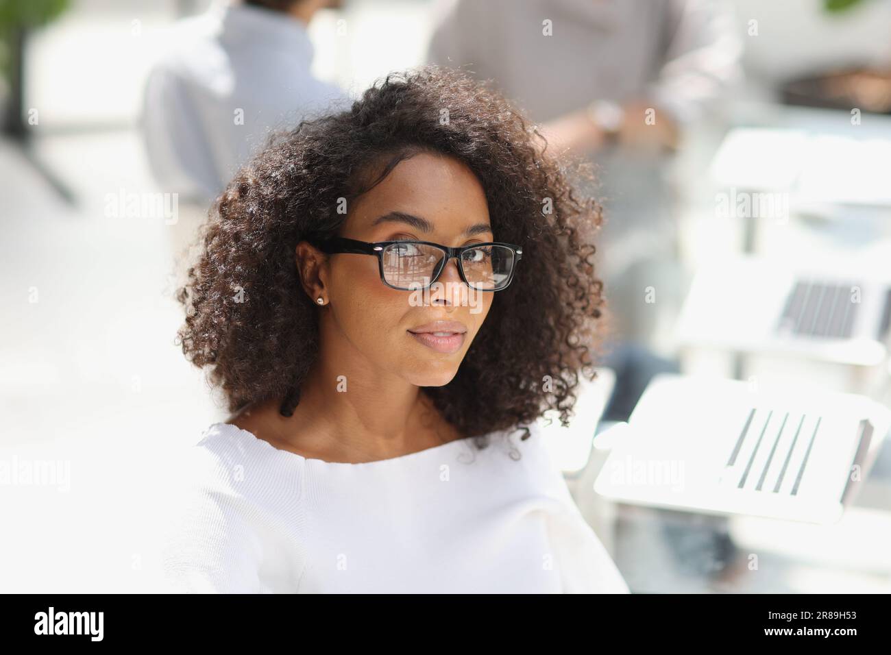 young attractive african american woman in the office Stock Photo - Alamy