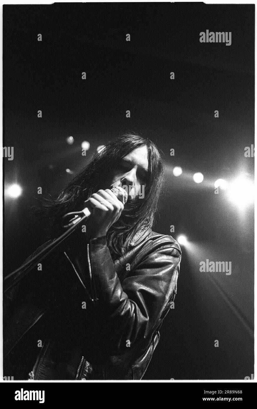 PRIMAL SCREAM, CONCERT, 1994: Bobby Gillespie of Scottish band Primal Scream playing live at the Great Hall, Cardiff University, Wales, UK on 7 April 1994. Photo: Rob Watkins. INFO: rimal Scream, a Scottish rock band, is known for their genre-defying approach. Albums like 'Screamadelica' fused rock with dance and won the Mercury Prize. Their diverse discography spans psychedelic, alternative, and electronic realms, reflecting their evolution and enduring influence. Stock Photo