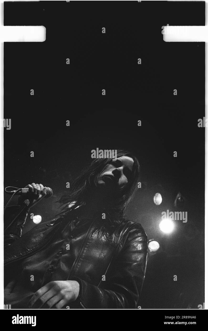 PRIMAL SCREAM, CONCERT, 1994: Bobby Gillespie of Scottish band Primal Scream playing live at the Great Hall, Cardiff University, Wales, UK on 7 April 1994. Photo: Rob Watkins. INFO: rimal Scream, a Scottish rock band, is known for their genre-defying approach. Albums like 'Screamadelica' fused rock with dance and won the Mercury Prize. Their diverse discography spans psychedelic, alternative, and electronic realms, reflecting their evolution and enduring influence. Stock Photo