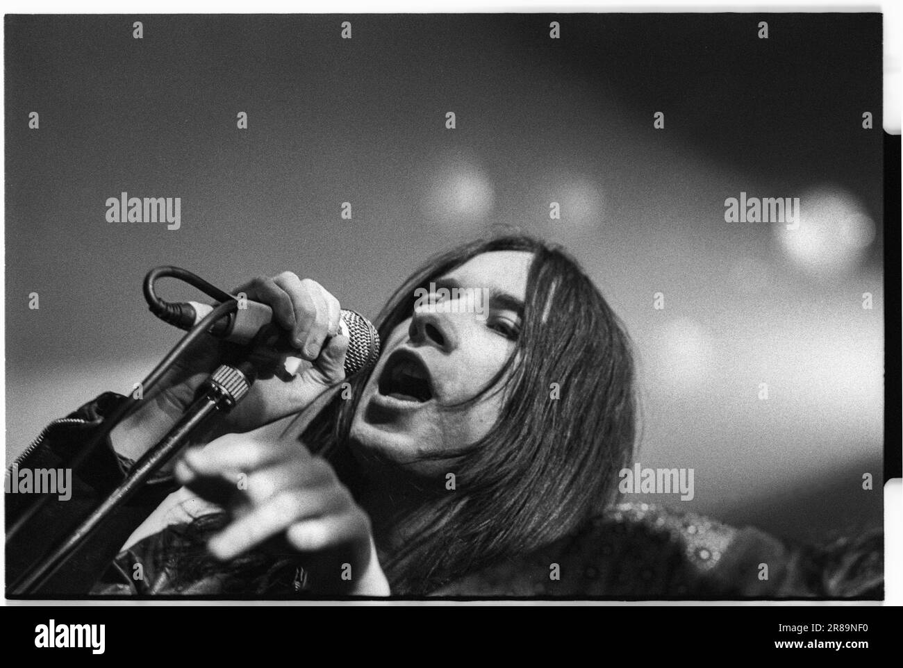 PRIMAL SCREAM, CONCERT, 1994: Bobby Gillespie of Scottish band Primal Scream playing live at the Great Hall, Cardiff University, Wales, UK on 7 April 1994. Photo: Rob Watkins. INFO: rimal Scream, a Scottish rock band, is known for their genre-defying approach. Albums like 'Screamadelica' fused rock with dance and won the Mercury Prize. Their diverse discography spans psychedelic, alternative, and electronic realms, reflecting their evolution and enduring influence. Stock Photo