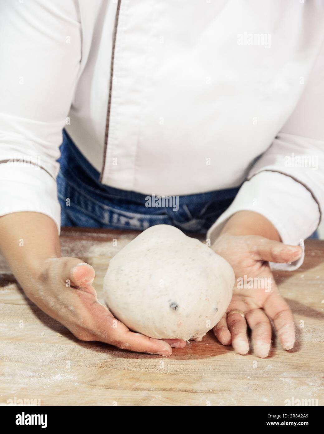 Kneading and preparation of sourdoughbased bread. On a wooden table. in bakery Stock Photo Alamy