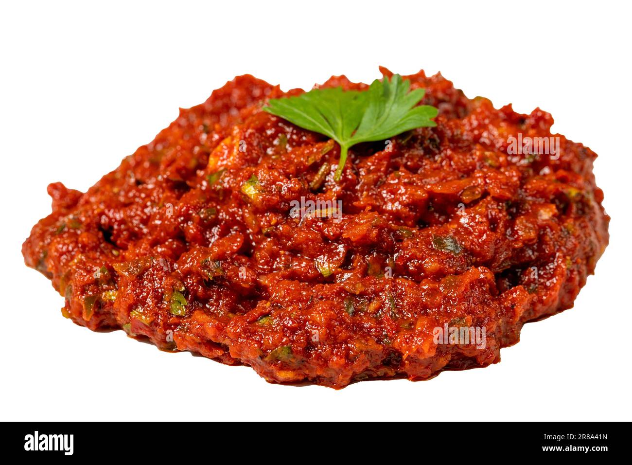 Hot chili peppers harissa sauce isolated on white background.. red