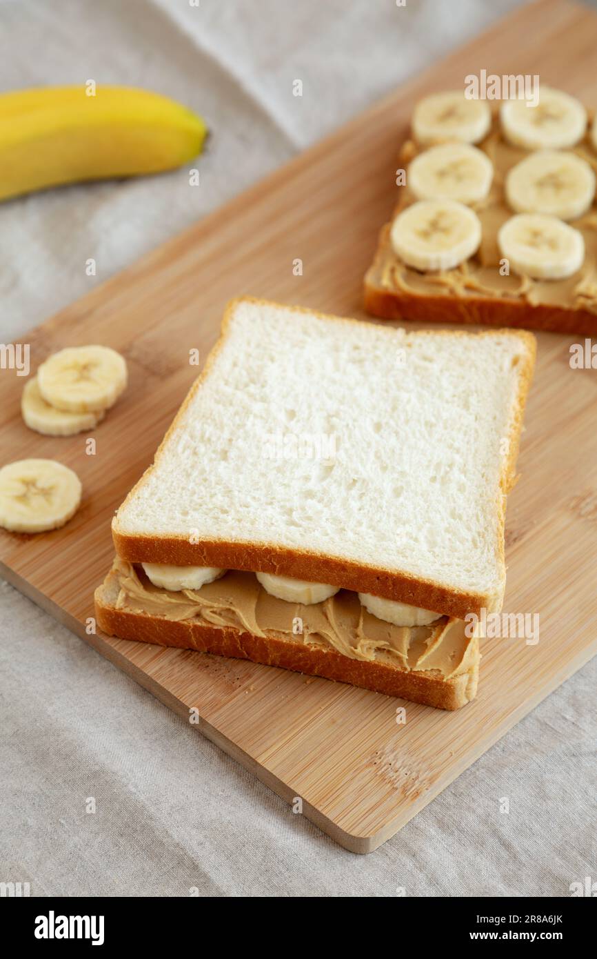 Homemade Peanut Butter Banana Sandwich on a Bamboo Board, side view