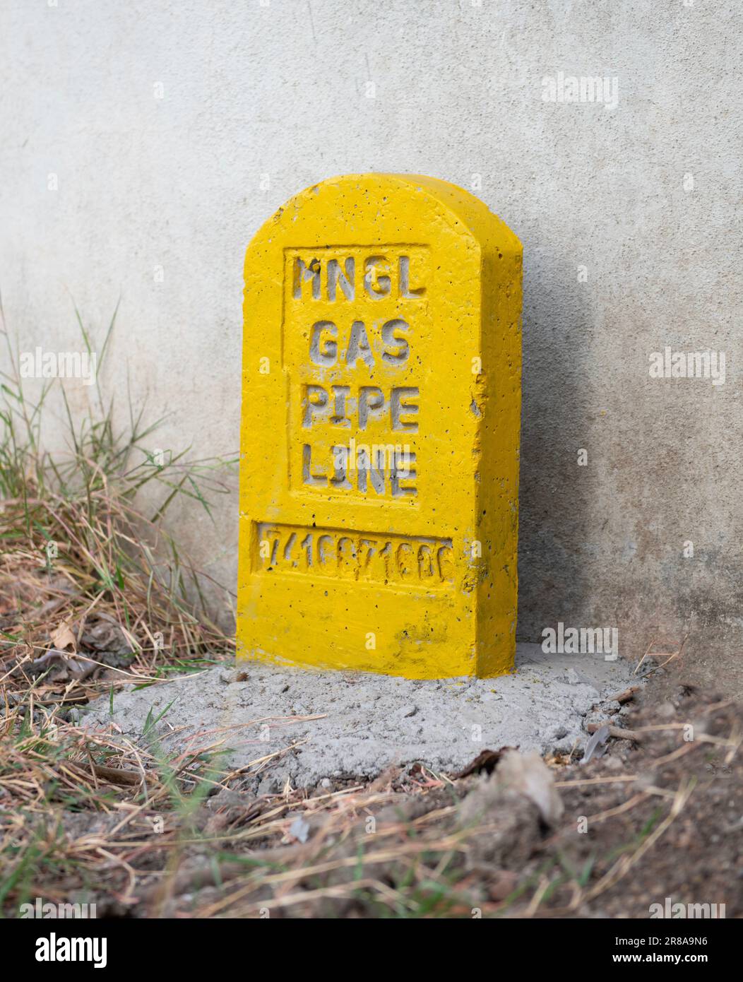 Marker stone by Maharashtra Natural Gas Ltd marking the underground