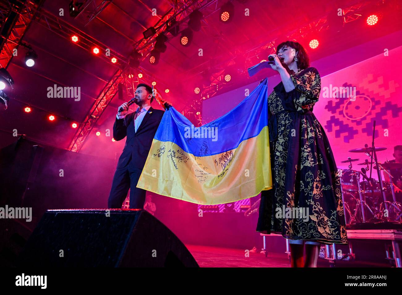 LVIV, UKRAINE - JUNE 17, 2023 - Hosts hold a Ukrainian flag during the