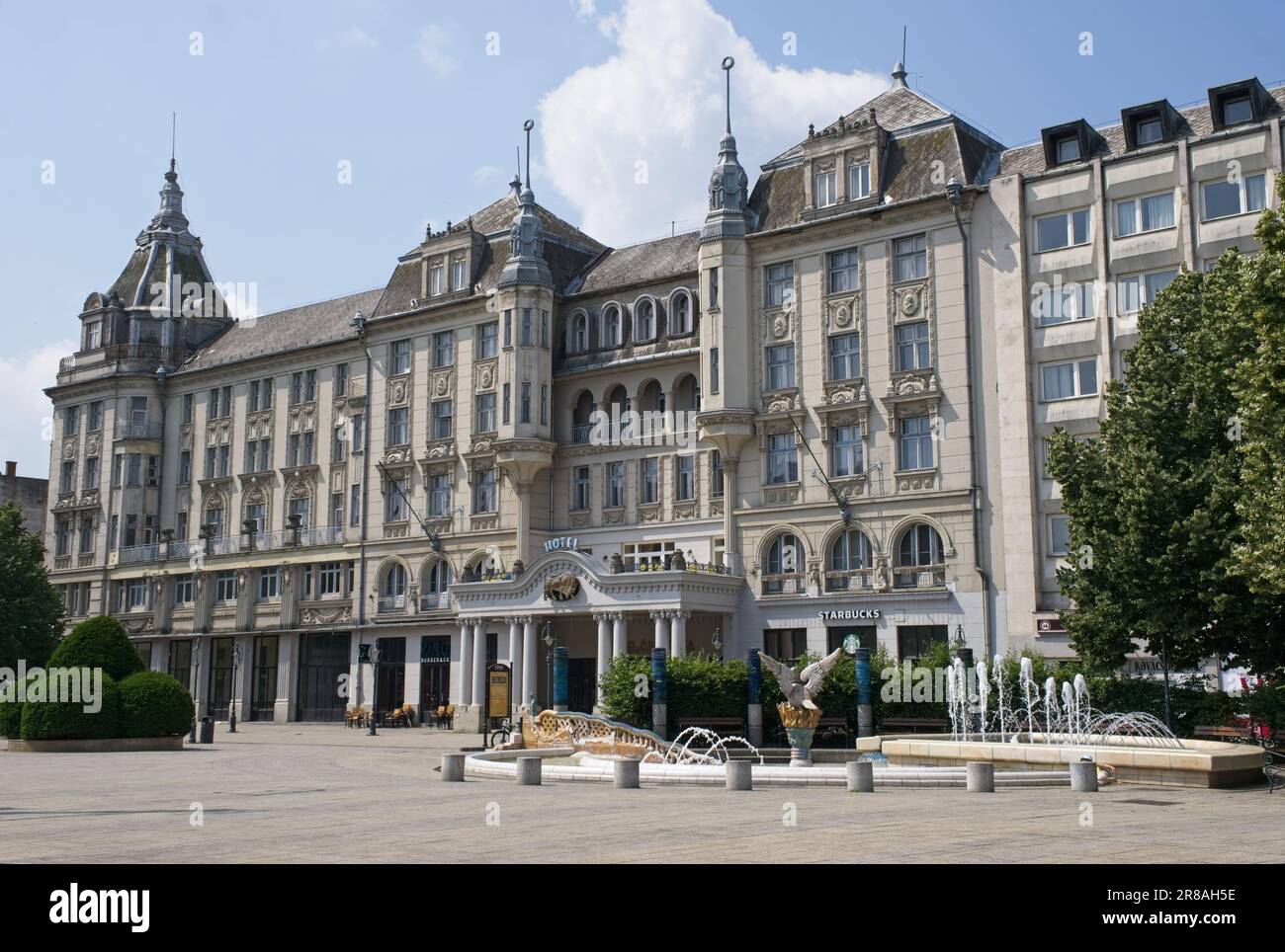 Debrecen, Hungary - Jun 18, 2023: A walking in the center of Debrecen city in northeastern Hungary in a sunny spring day. Grand Hotel Aranybika. Selec Stock Photo