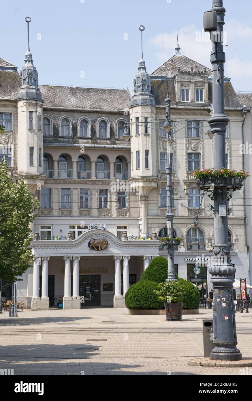 Debrecen, Hungary - Jun 18, 2023: A walking in the center of Debrecen city in northeastern Hungary in a sunny spring day. Grand Hotel Aranybika. Selec Stock Photo