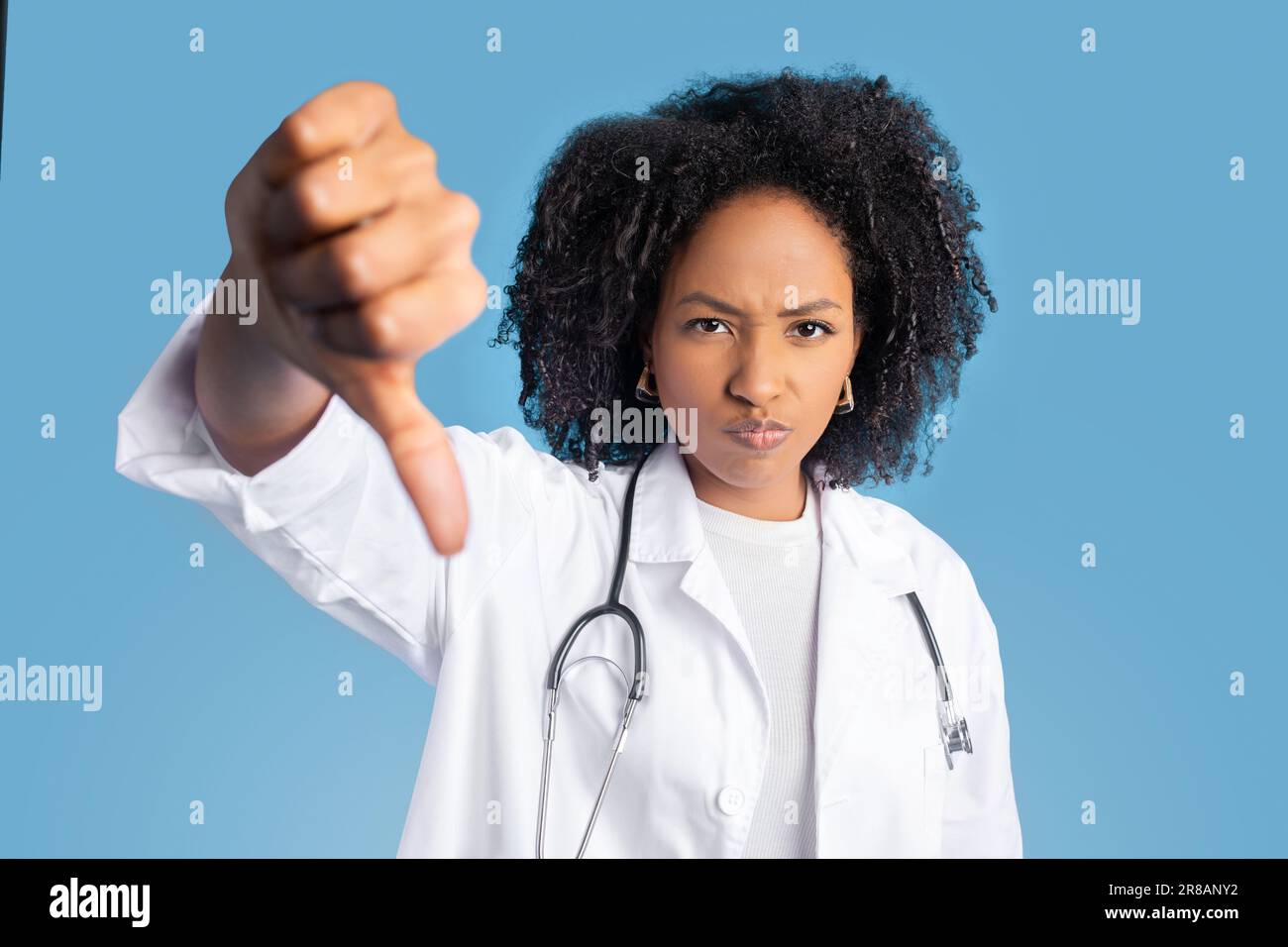 Angry woman doctor in blue hi-res stock photography and images - Alamy