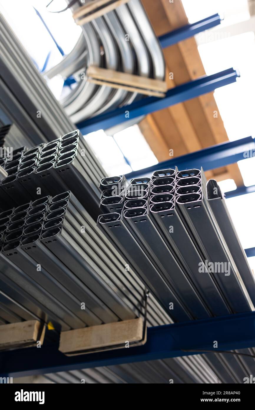 Shallow Steel Stock of raw metal materials in a facatory hall (shallow DOF; color ...