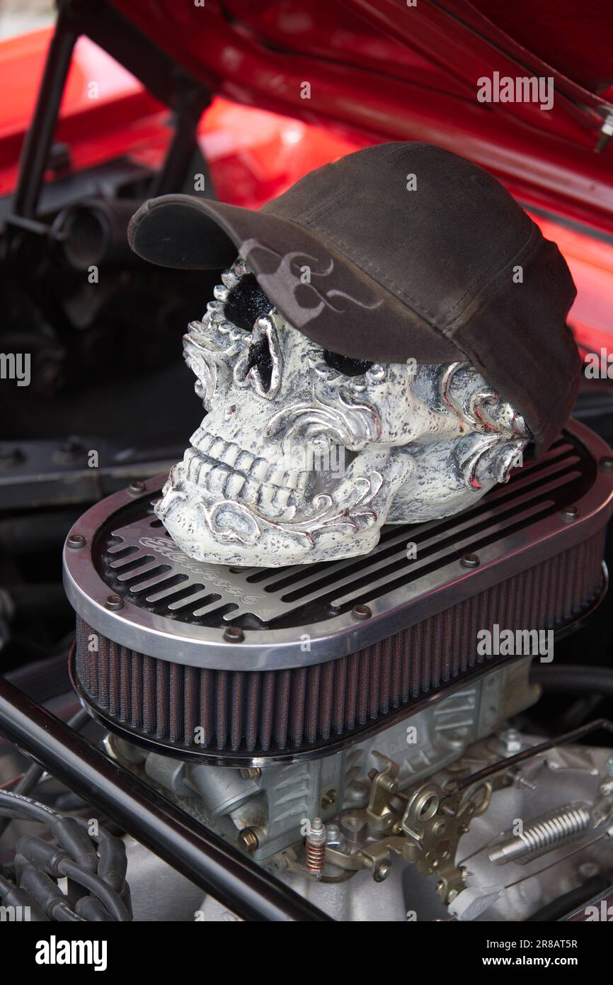 Father's Day Auto Show - Hyannis, Massachusetts, Cape Cod - USA. A skull sits atop the engine of am automobile on display Stock Photo