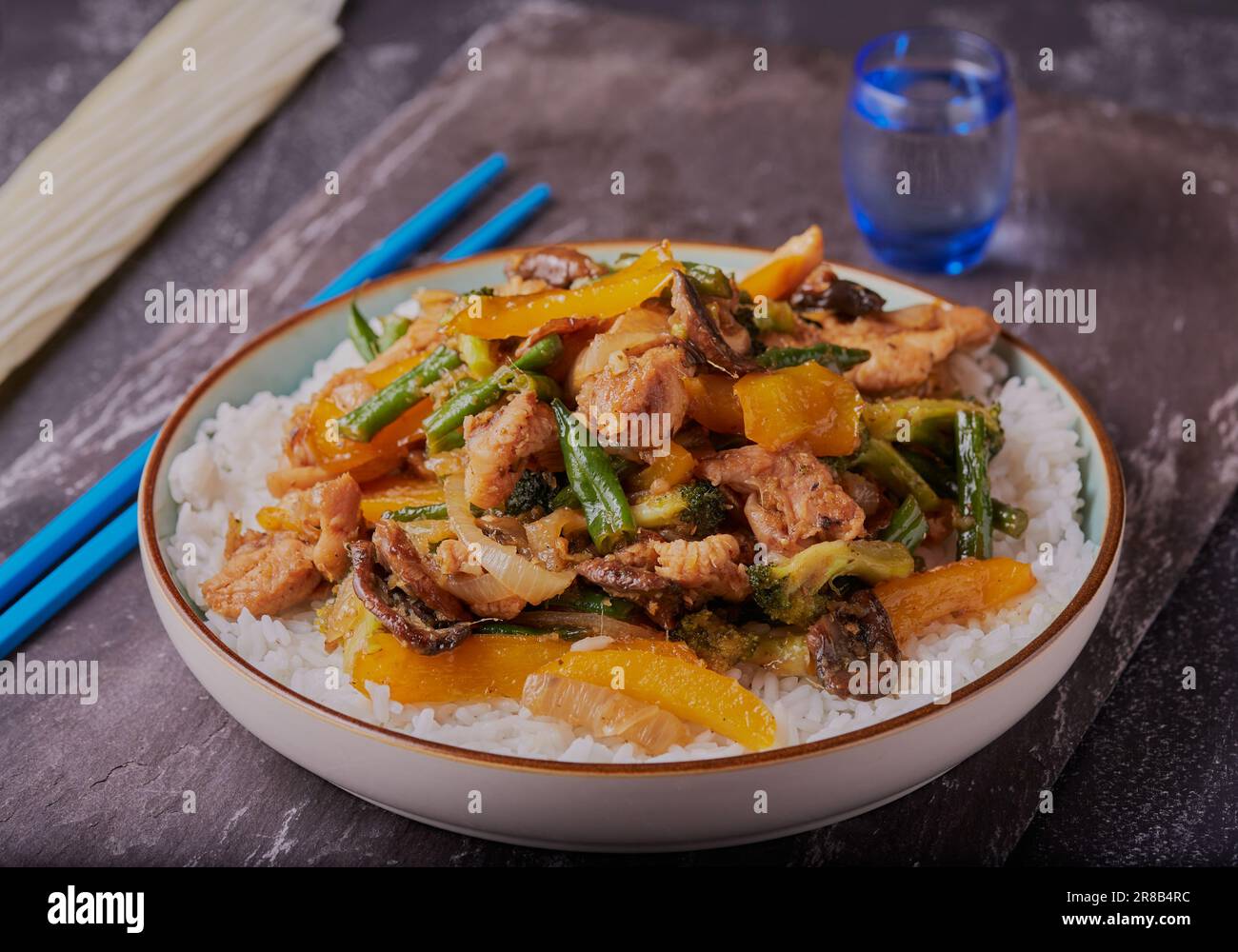 Asian styled chicken stir-fry with white rice Stock Photo - Alamy
