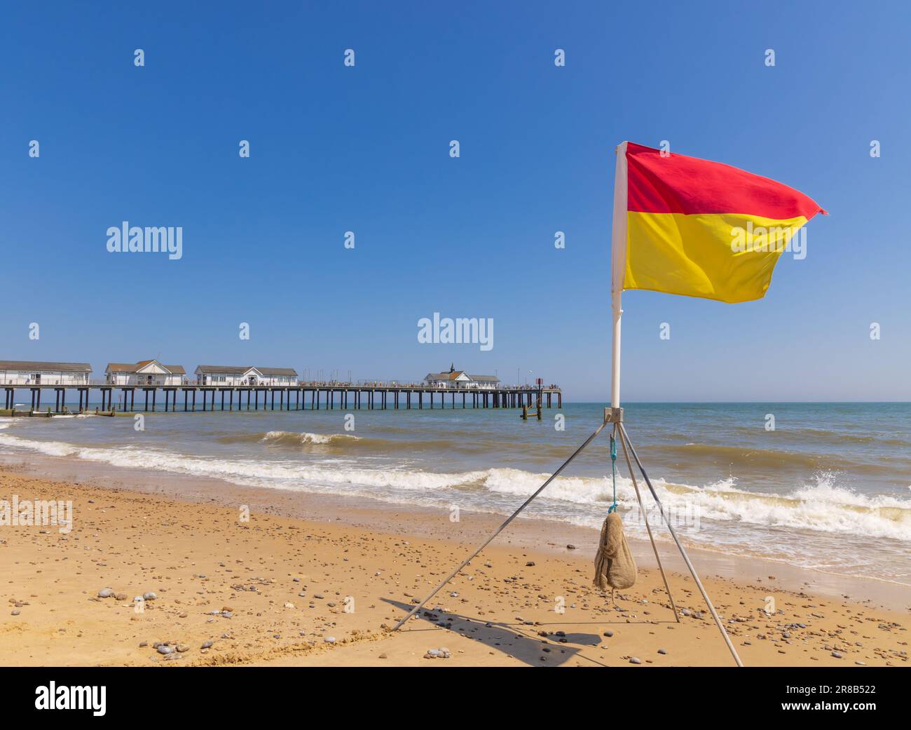 Swimming safety lifeguard flag erected by the RNLI on the beach in