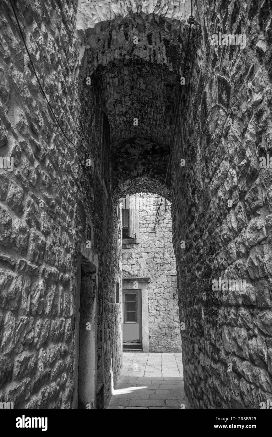 An arched alleyway in a quiet back street in the historic coastal city