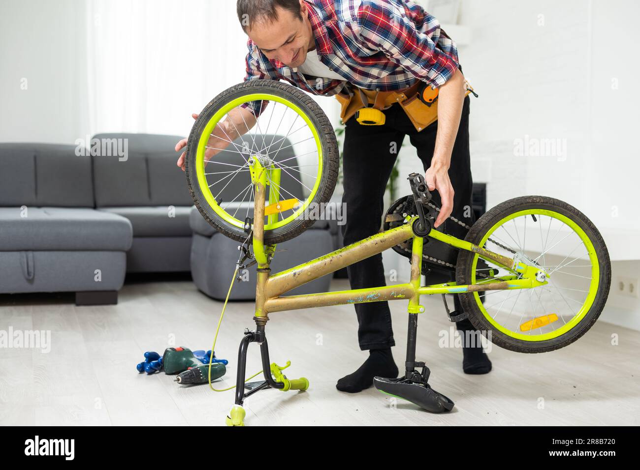 bicycle mechanic adjusting front derailleur mechanism on mountain bike