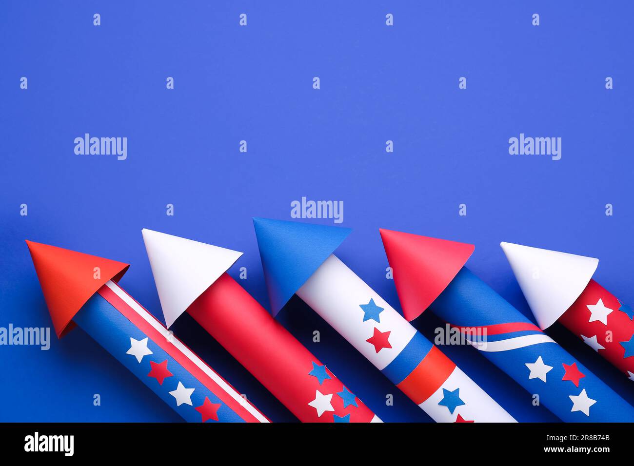 Firework rockets for Independence Day on blue background Stock Photo ...