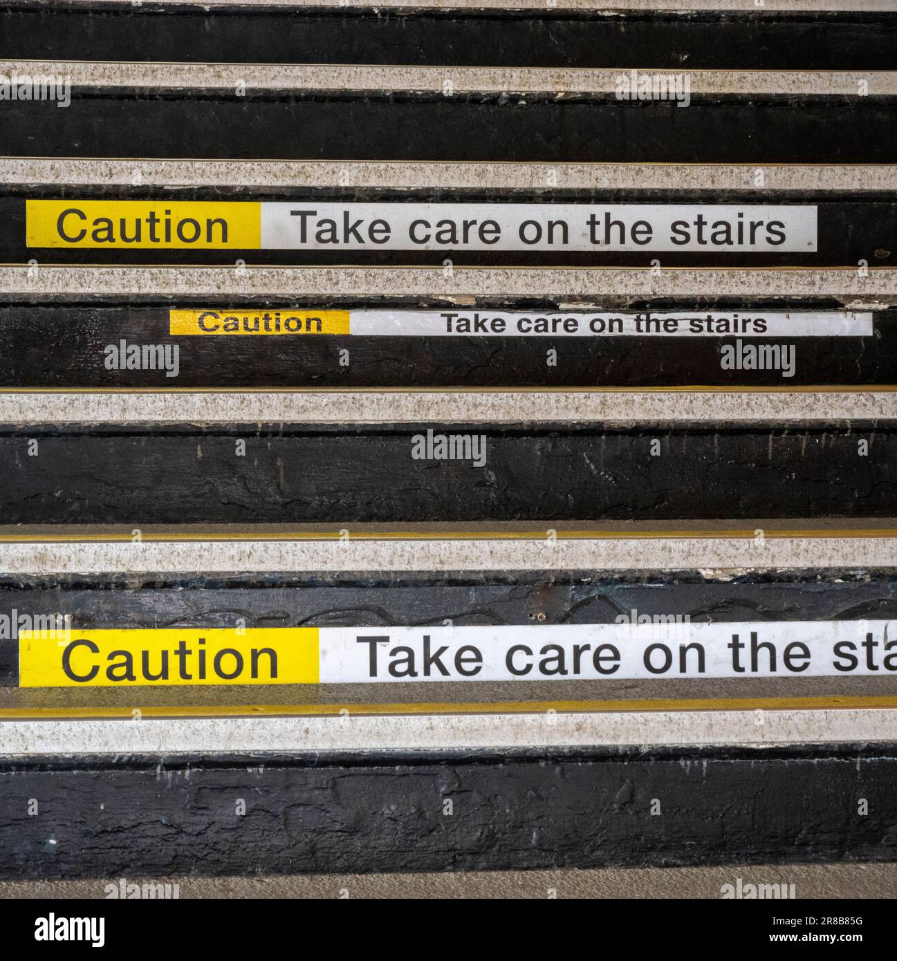 Hazard Warning – A Caution take Care On The Stairs sign Stock Photo