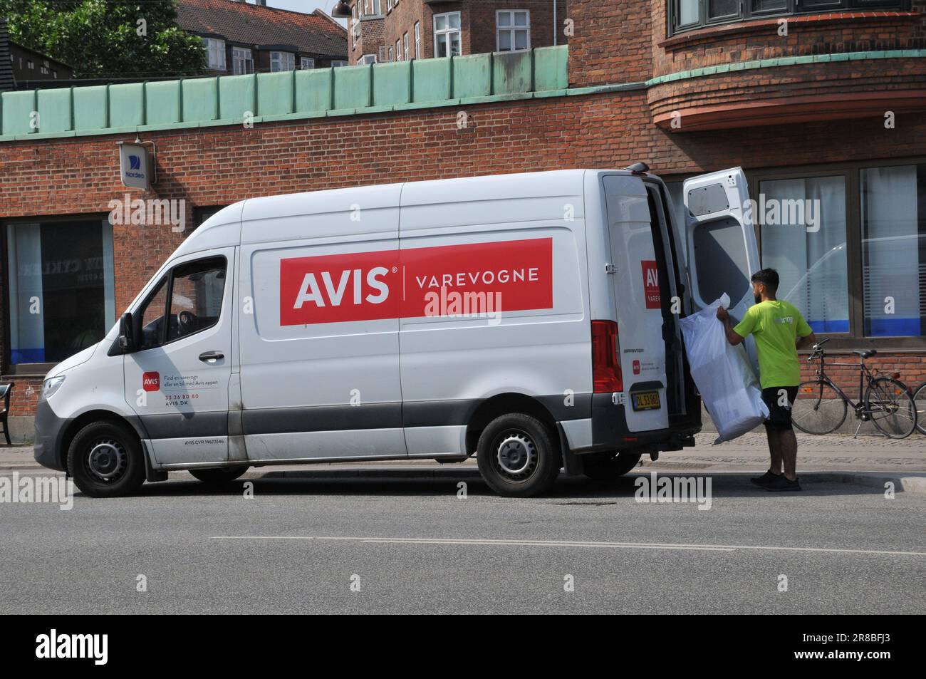 20 June 2023/ Avis good delivery male and van in danish capital Copenhagen Denmark.   (Photo.Francis Dean/Dean Pictures) Stock Photo