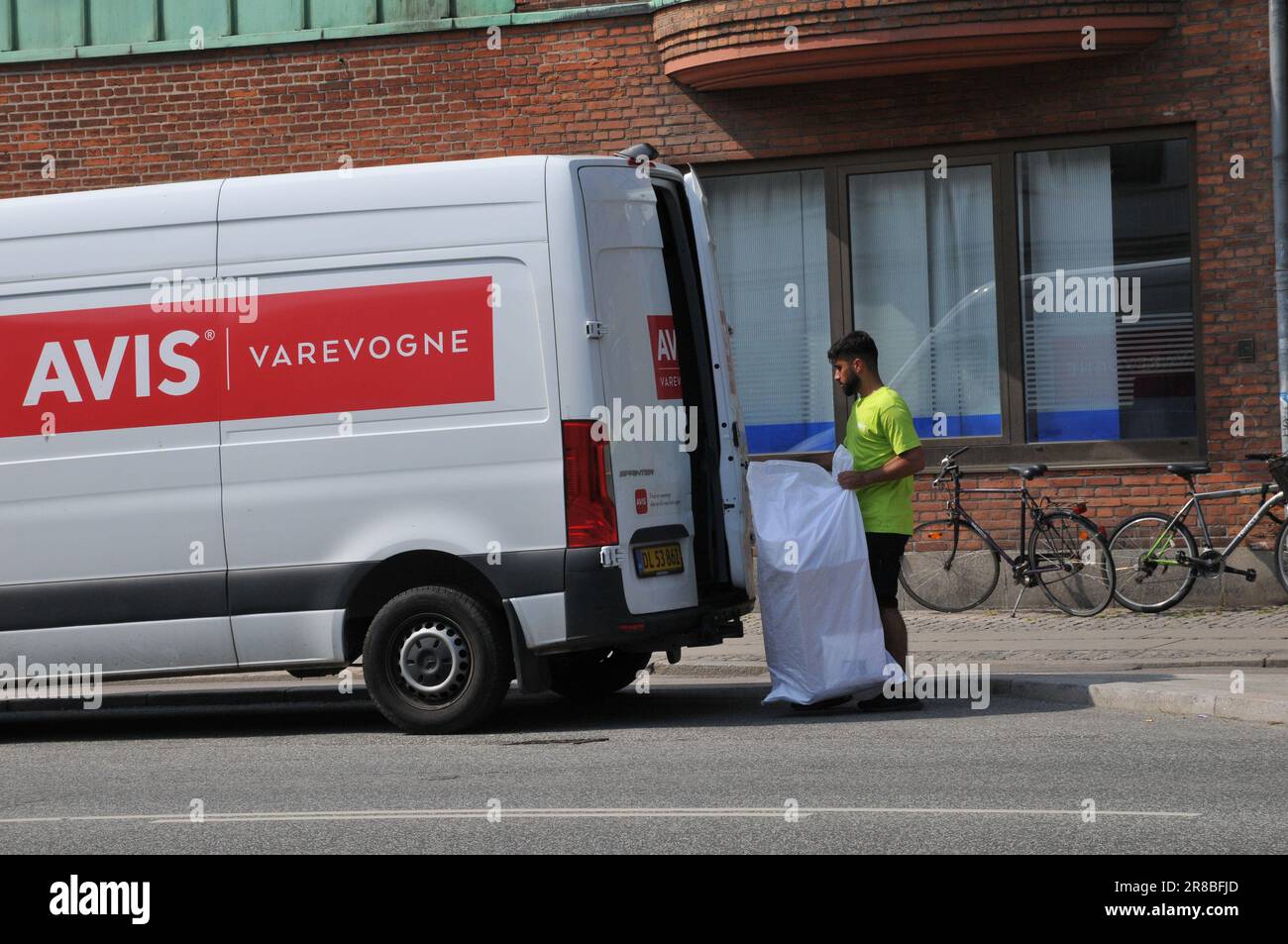20 June 2023/ Avis good delivery male and van in danish capital Copenhagen Denmark.   (Photo.Francis Dean/Dean Pictures) Stock Photo