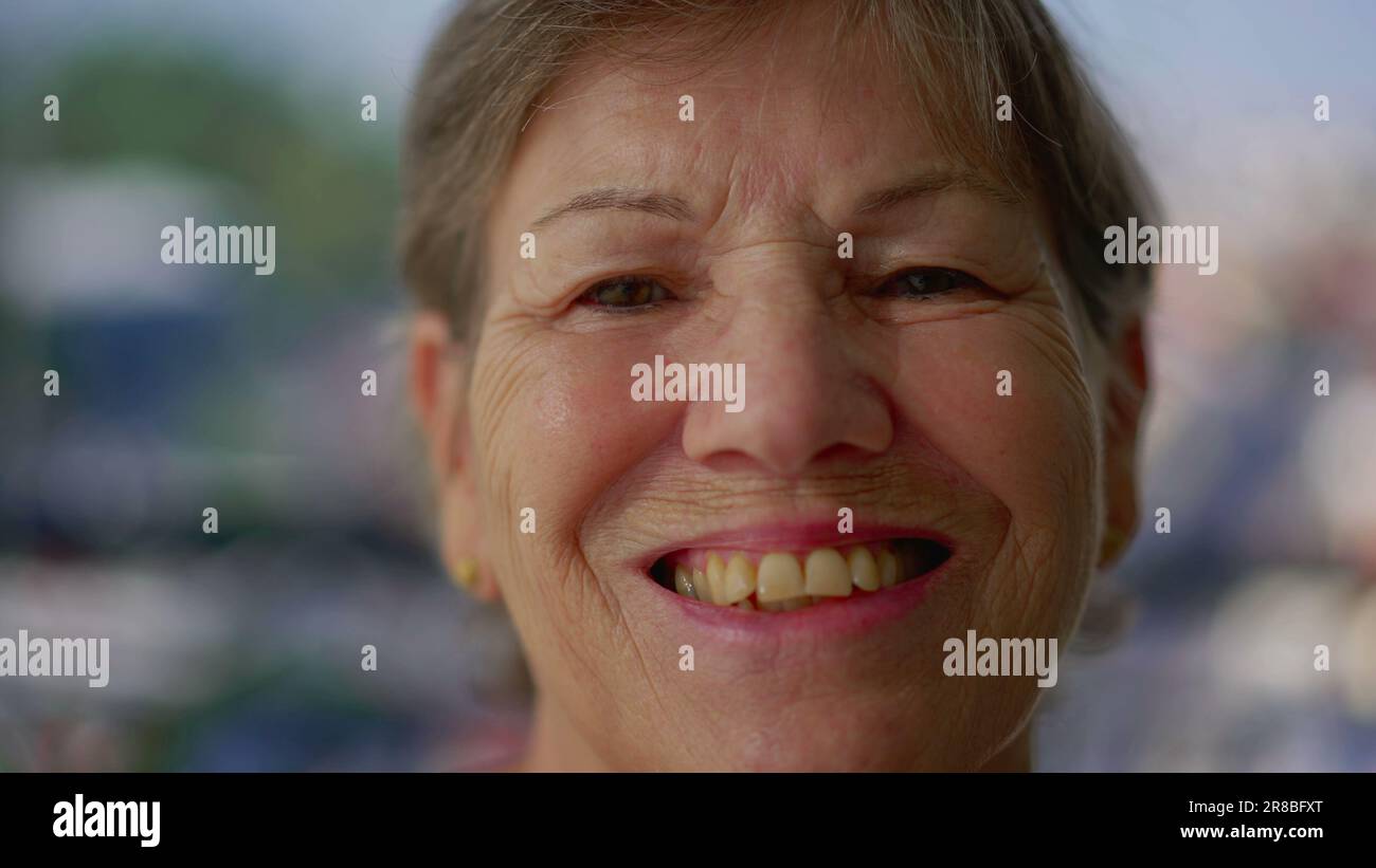 Portrait of a joyful senior woman close-up face smiling at camera Stock ...