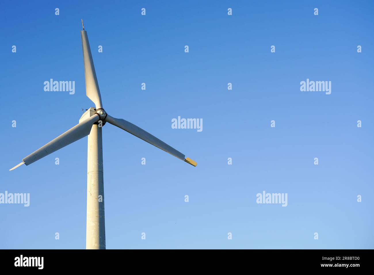 Abstract wind mill or also wind turbine to generate electricity energy ...