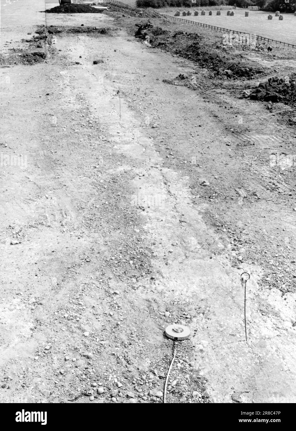 Motorway construction in the 1970-80s. Showing newly constructed roads with virtually no traffic. Road workers and faults in construction. Stock Photo