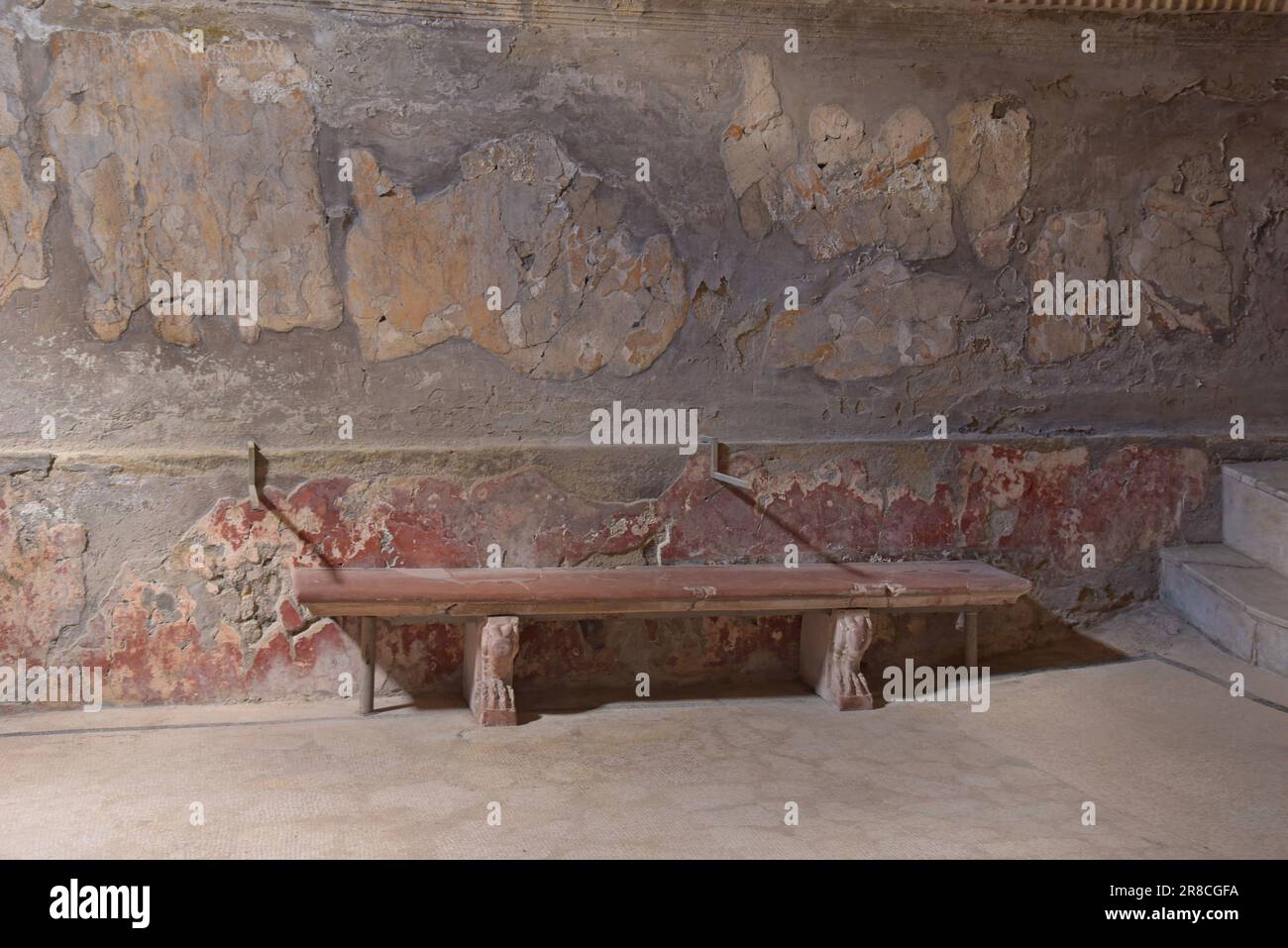 A stone bench in the public baths at the  Roman town of Herculaneum, buried in the Vesuvius eruption AD79, Ercolano, Naples, Italy Stock Photo