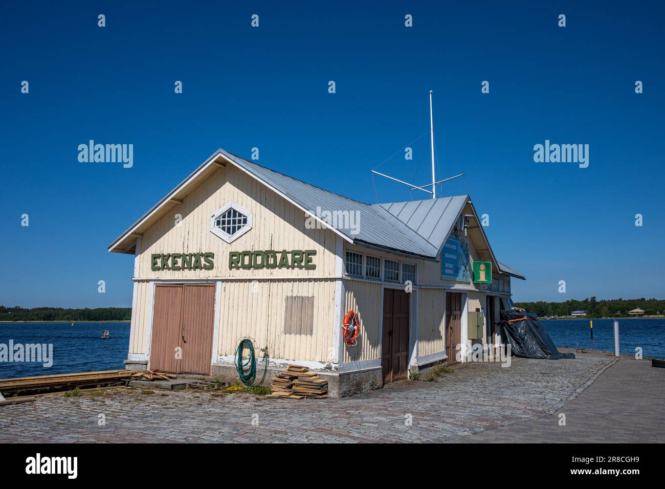 Derelict wooden storage building or boathouse of Ekenäs Roddare rowing club against clear blue sky in Tammisaari, Finland Stock Photo