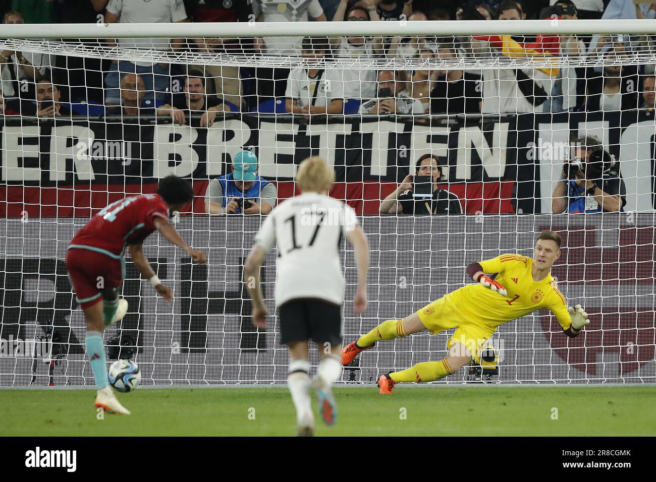GELSENKIRCHEN - 20/06/2023, (LR) Juan Cuadrado of Colombia scores the 0-2, Germany goalkeeper Marc-Andre ter Stegen during the friendly international match between Germany and Colombia at the Veltins-Arena on June 20, 2023 in Gelsenkirchen, Germany. AP | Dutch Height | BART STOUTJESDYK Stock Photo
