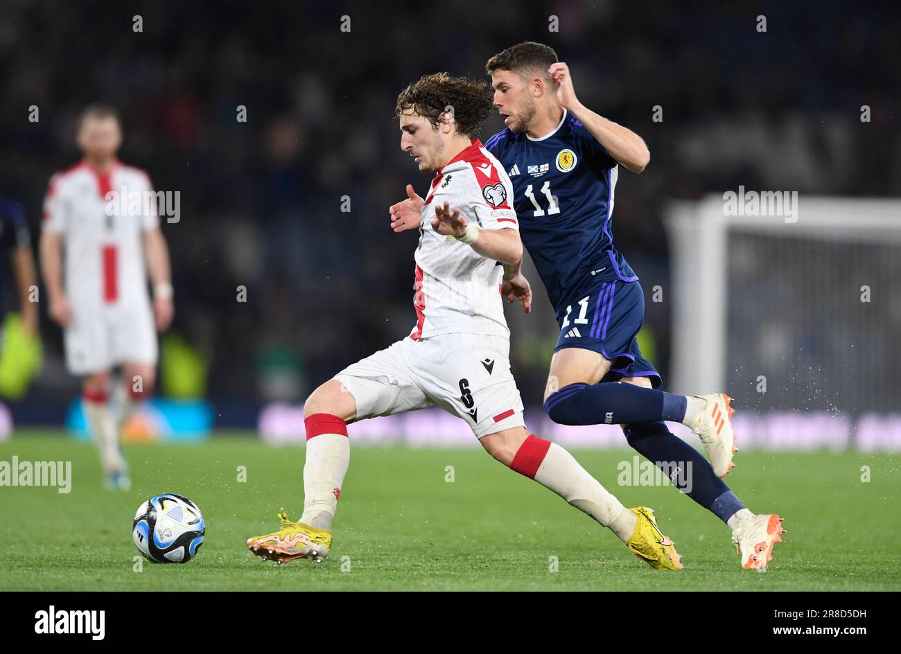 Glasgow, UK. 20th June, 2023. Luka Gagnidze of Georgia and Ryan Christie of Scotland during the UEFA European Championship Qualifying match at Hampden Park, Glasgow. Picture credit should read: Neil Hanna/Sportimage Credit: Sportimage Ltd/Alamy Live News Stock Photo