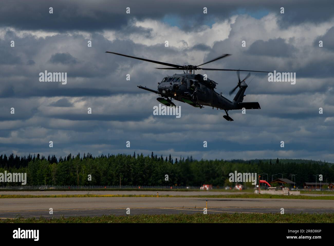 A U.S. Air Force HH-60 Pave Hawk lands at Eielson Air Force Base, Alaska, during Red Flag-Alaska 2023 June 14, 2023. The Joint Pacific Alaska Range Complex airspace covers more than 77,000 square miles and provides a realistic training environment, allowing Airmen to train for a full spectrum of engagements, ranging from individual skills to complex, large-scale joint engagements. (U.S Air Force photo by Senior Airman Cedrique Oldaker) Stock Photo