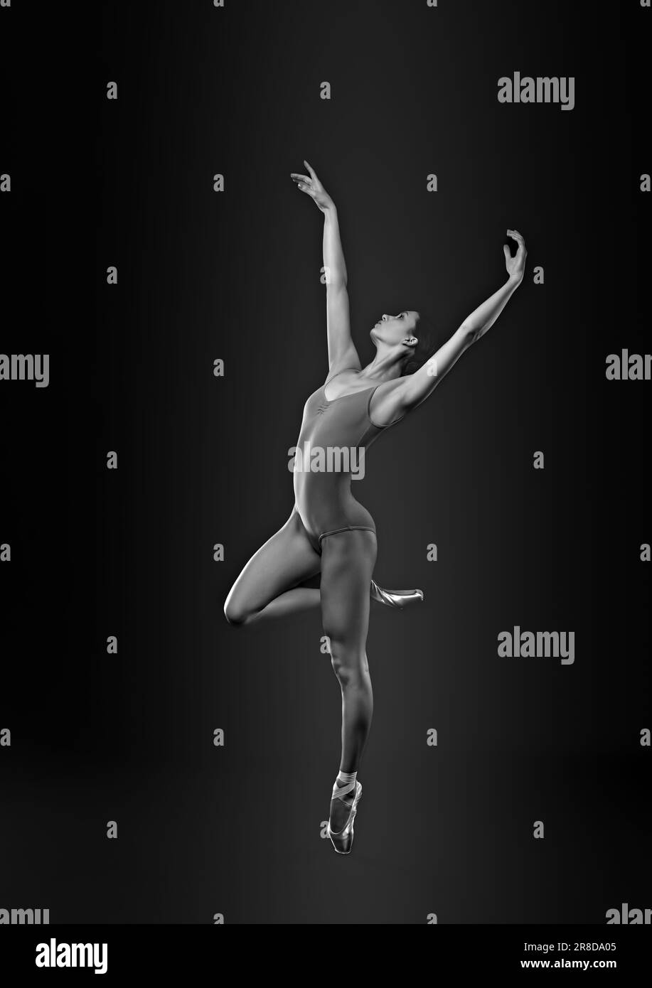 Young ballerina in pointe shoes dancing. Black and white effect Stock Photo