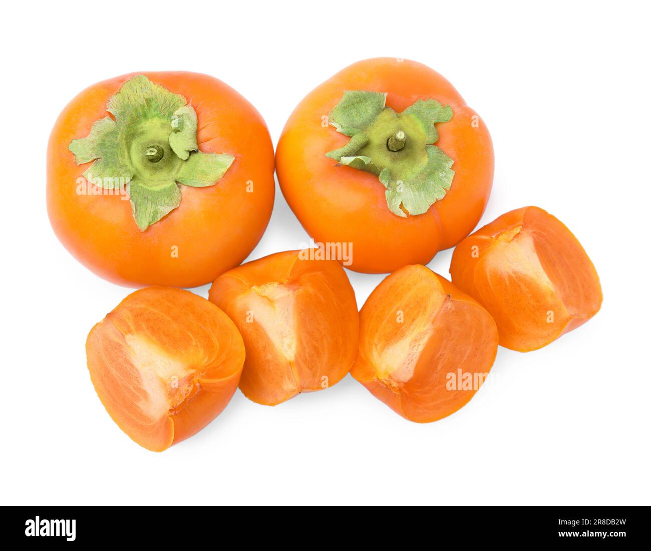 Whole and cut delicious ripe juicy persimmons on white background, top ...