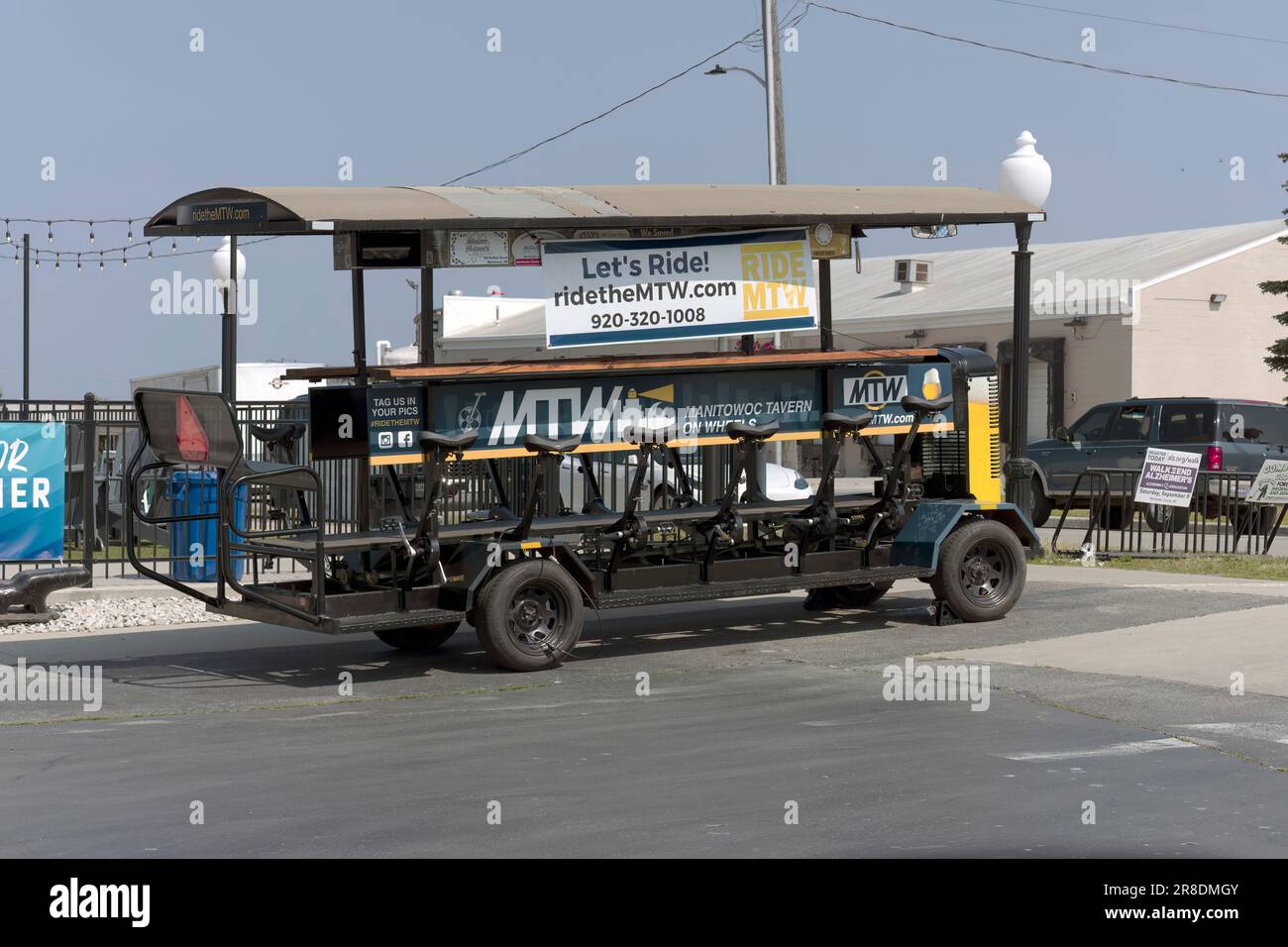 Manitowoc, WI USA Jun 20 2023: The Manitowoc Tavern on Wheels-  pedal-powered, eco-friendly, city-crawler,14-person pedal-powered trolley. Stock Photo